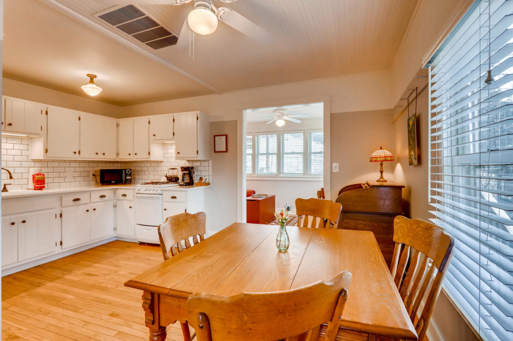 white kitchen and large dining table at Chautauqua