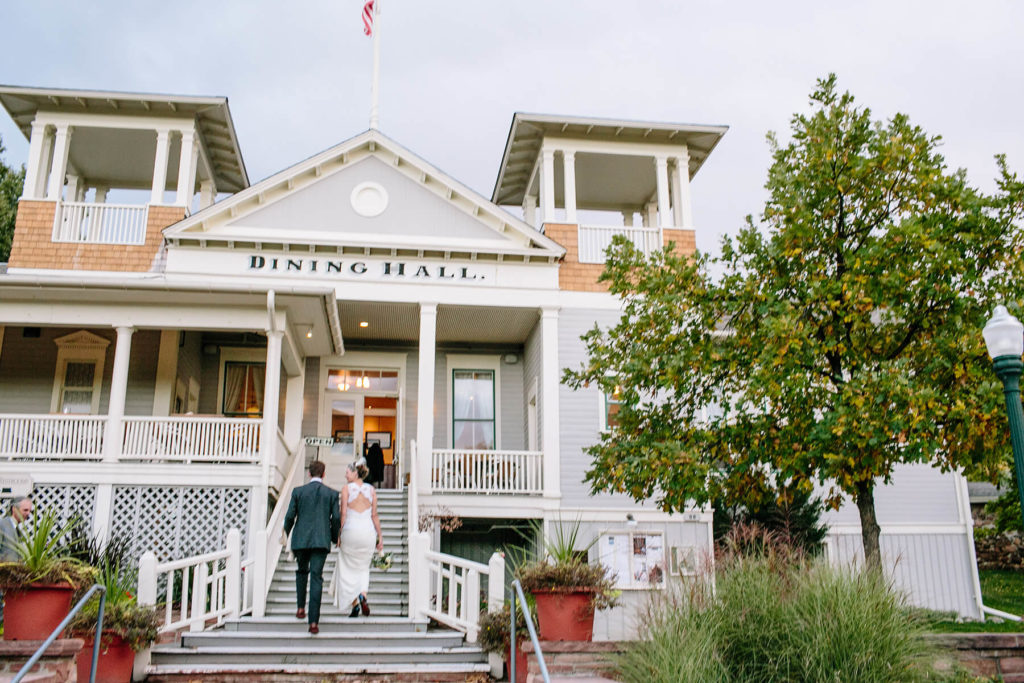bride and groom climb steps up to Dining Hall in Chautauqua