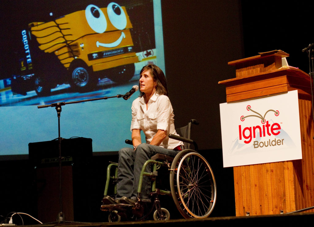 woman presents on state at Ignite Boulder