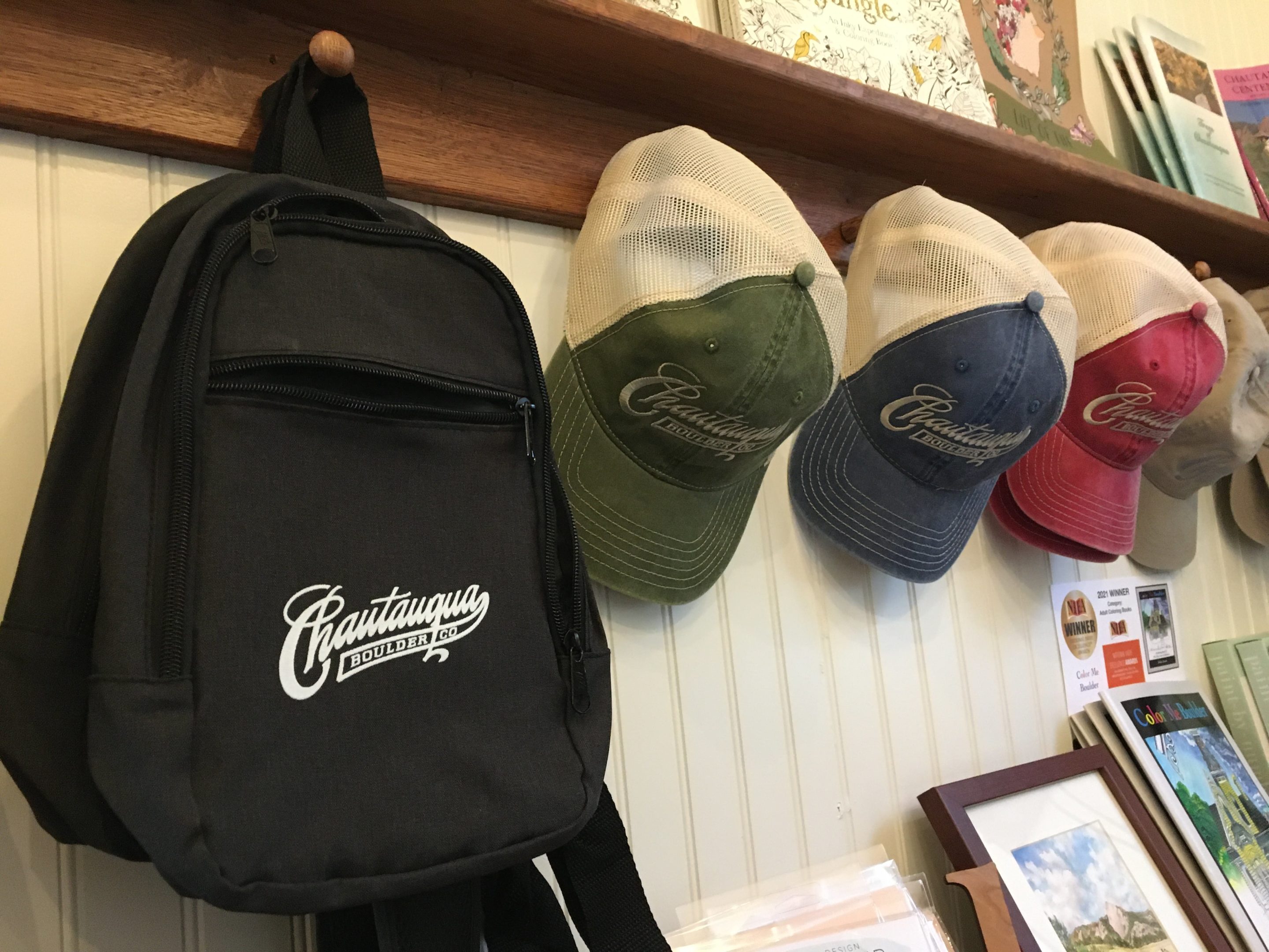 Chautauqua backpack and baseball caps in the general store