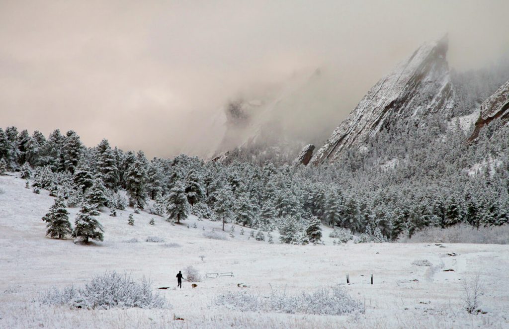 snowy landscape of mountains and runner