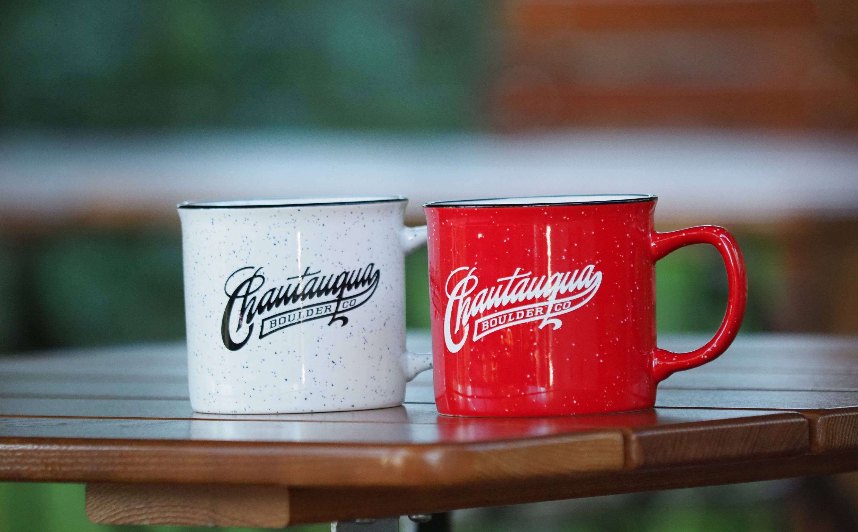 Chautauqua branded coffee mugs hanging up in the General Store